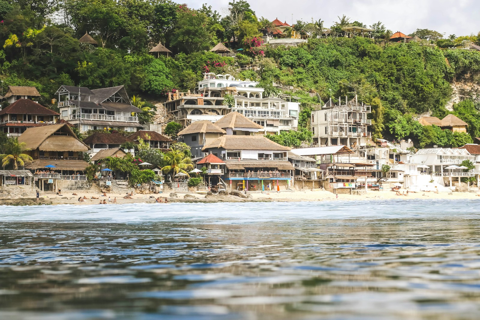 brown houses near sea